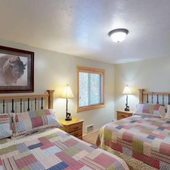 Bedroom #1 located on the main floor with 2 Queen size bed.