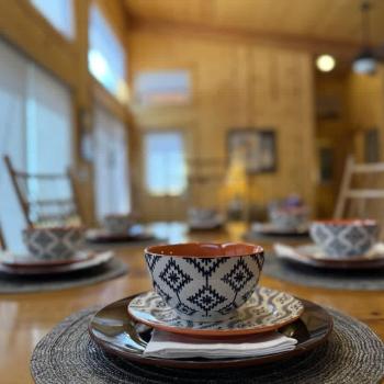 Large dining table with full place settings.