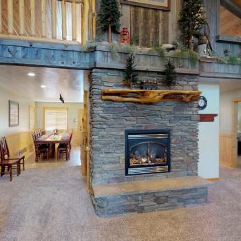 Main level living room with a fireplace, make sure to bring your own wood.