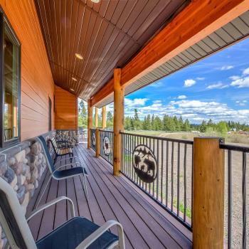 Front Deck with seating and view of the landscape beyond.