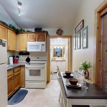 When you enter you are greeted by the kitchen and dining area.