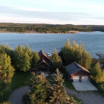 Beautiful view of the trees and water from the cabin.