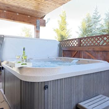 Relax after a long day in the hot tub located through the back door.