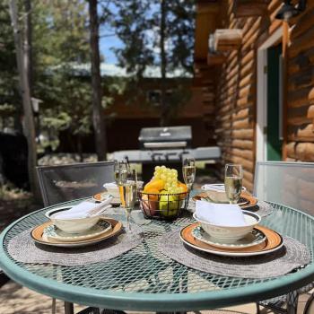 Open deck with a grill and seating.