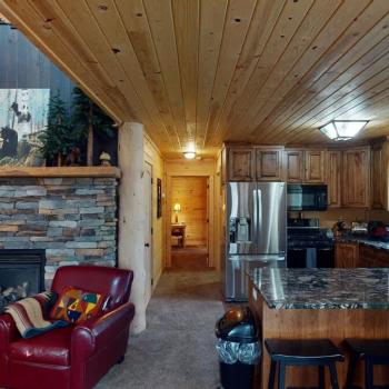 The living room is adjacent to the kitchen.