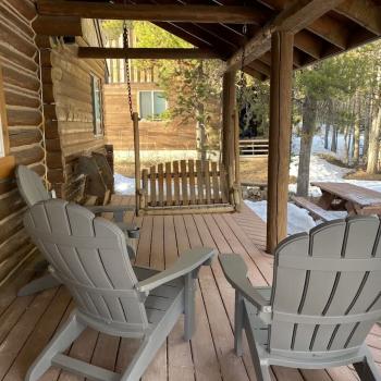 Patio with seating to enjoy the serenity of the cabin.