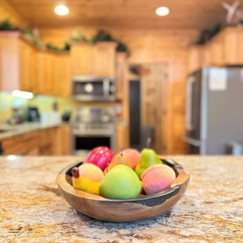 Every detail is designed for comfort. The expansive granite kitchen island offers plenty of open prep space to prepare fresh ingredients for your group.