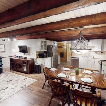 Upon entrance you are greeted by the dining area, living room, and kitchen.