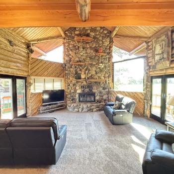 Enjoy the natural light in the living room with seating to relax during your stay.