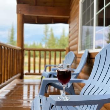 Porch with seating to enjoy the scenery.