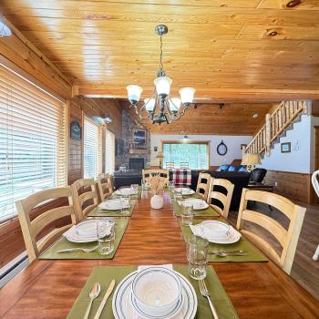 Dining table with seating for up to 8 people with 6 additional seats at the kitchen island.