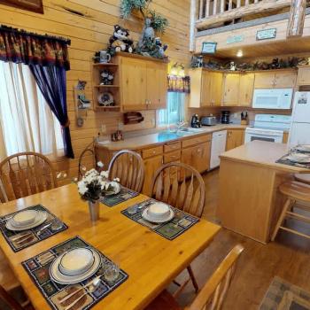 Upon entrance you are greeted by the dining table and kitchen.