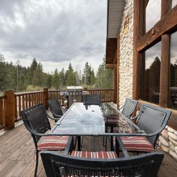 Enjoy the beautiful weather from the deck of the cabin.