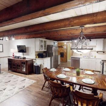Upon entrance you are greeted by the dining area, living room, and kitchen.