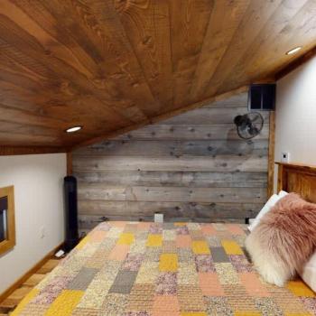 The loft bedroom as seen at the top of the stairs.