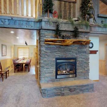 Main level living room with a fireplace, make sure to bring your own wood.
