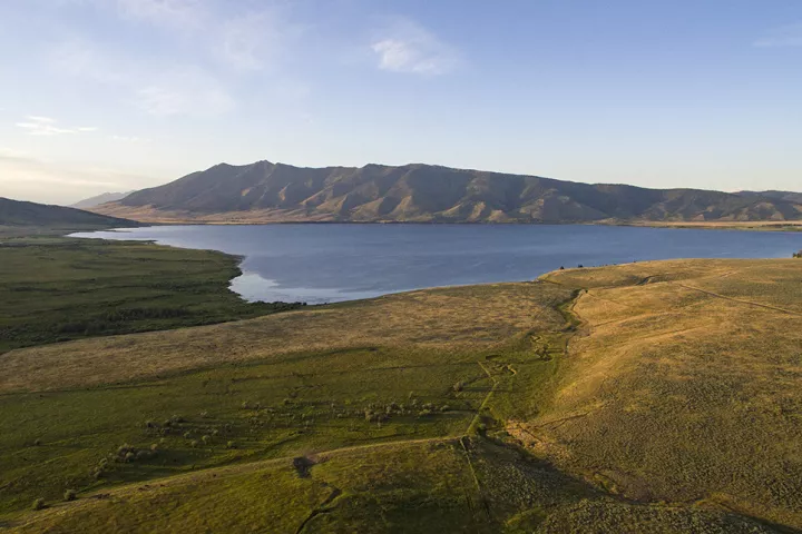 Henry's Lake in its wide mountain basin at sunset