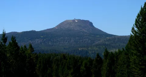 Sawtelle Peak rising above the forests of Island Park