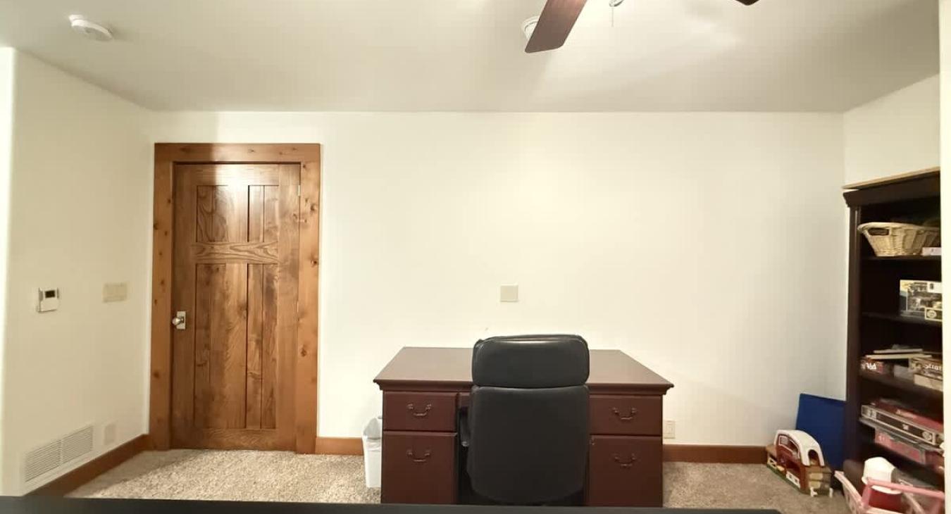 Desk and play area in the game room.