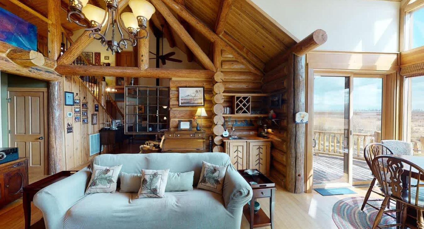 Natural light pours in through large windows, tying it all together with a view of the forest just beyond.