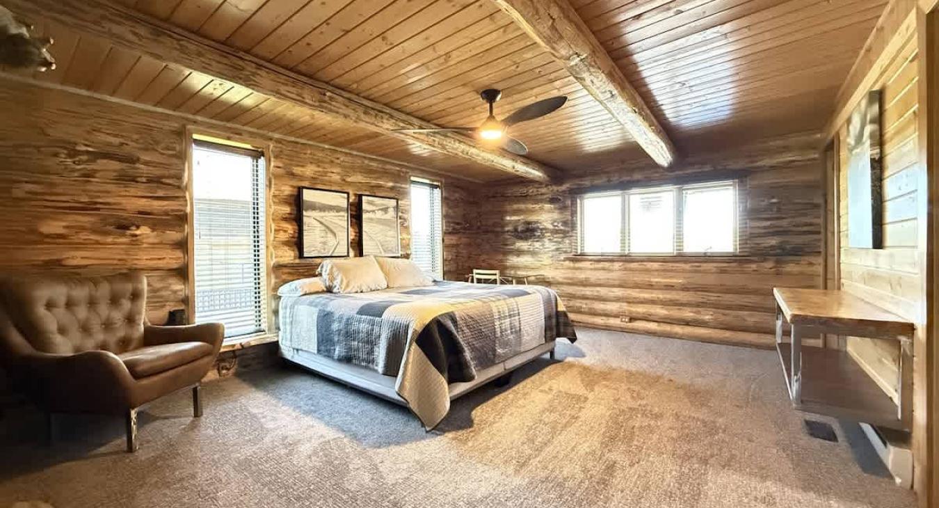 The master bedroom is located in the downstairs bedroom with an ensuite bathroom attached.