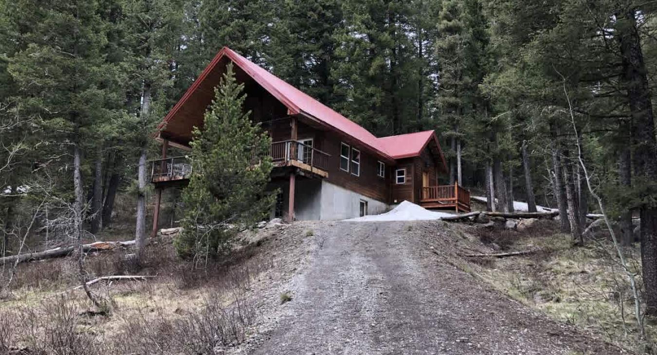 Beautiful area of the cabin with surrounding pine trees.