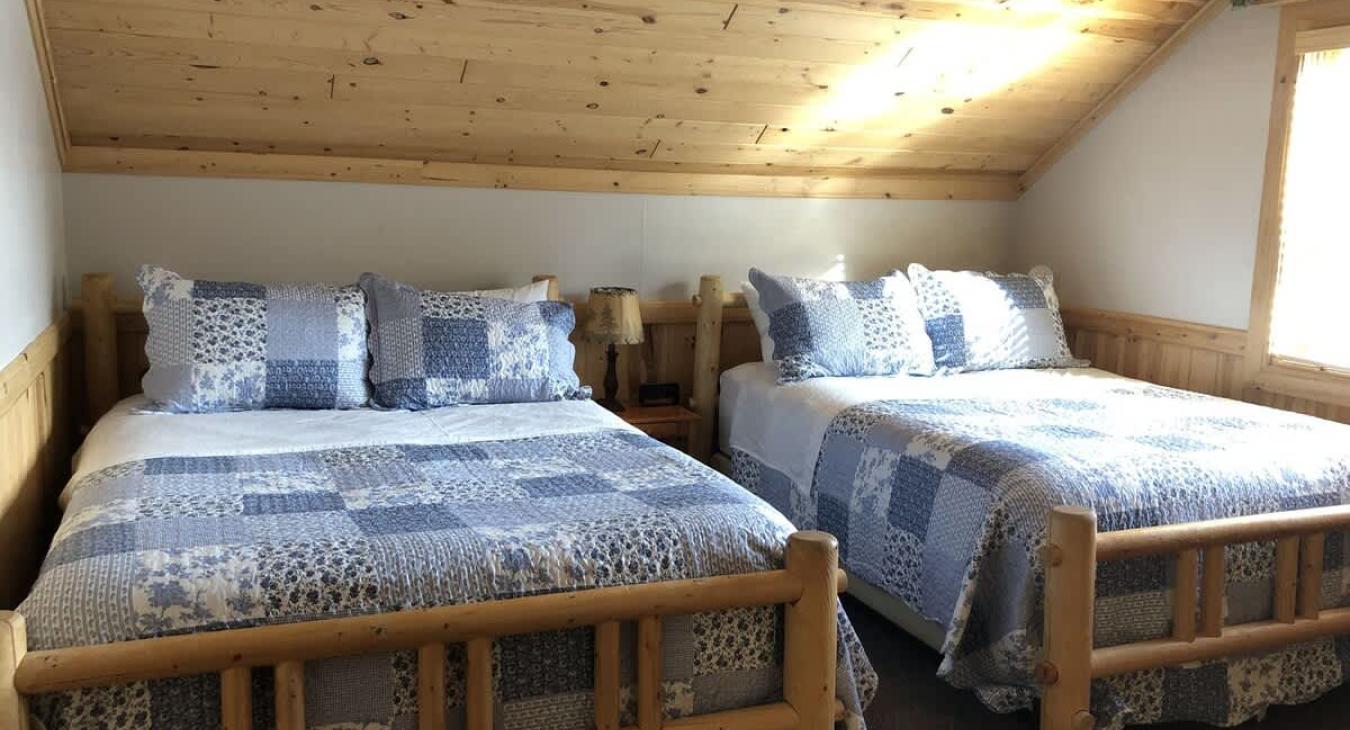 Bedroom #2 located upstairs with 2 Queen beds.