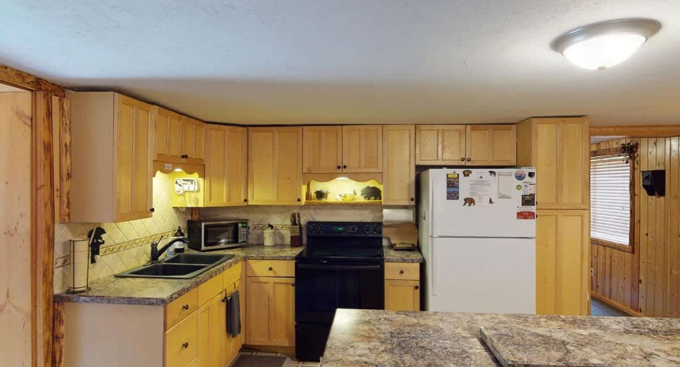 Full size kitchen with appliances, pots and pans, dishes, utensils, and basic cooking essentials.