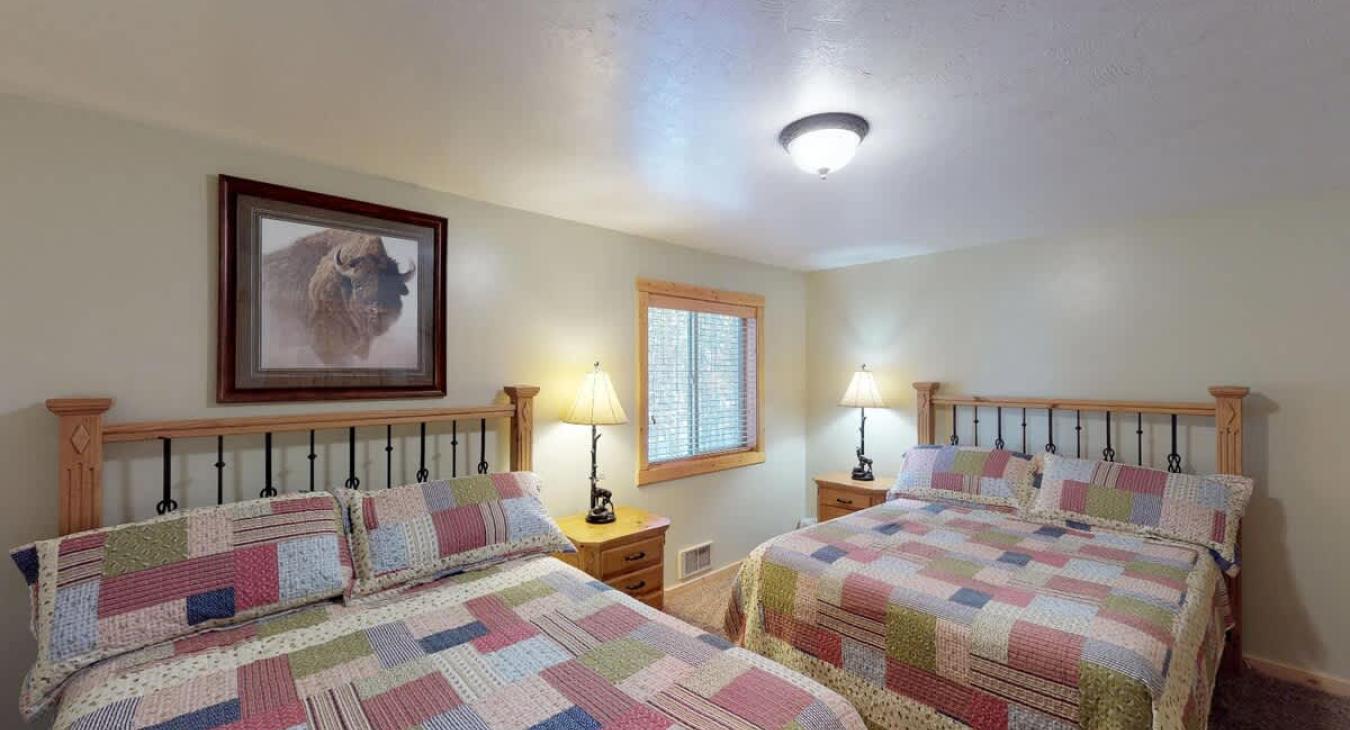 Bedroom #1 located on the main floor with 2 Queen size bed.