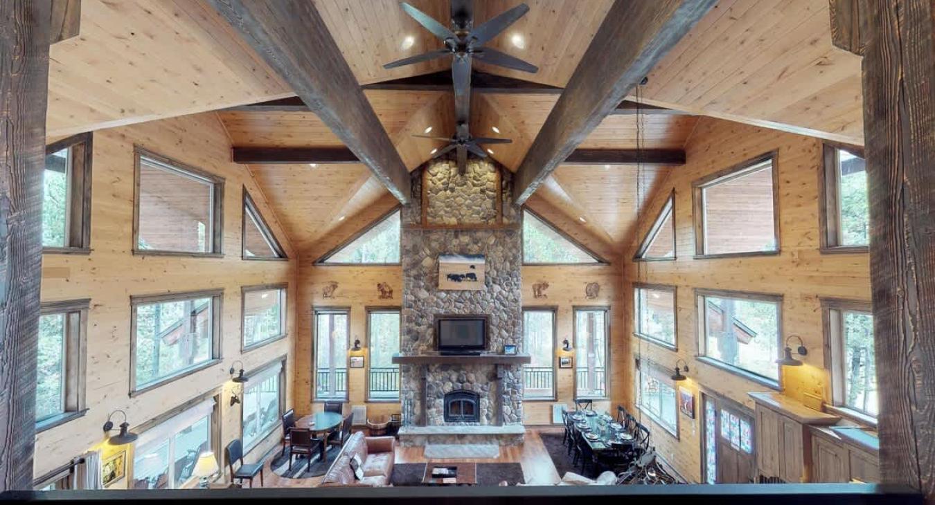 Natural light pours in through large windows, tying it all together with a view of the forest just beyond.