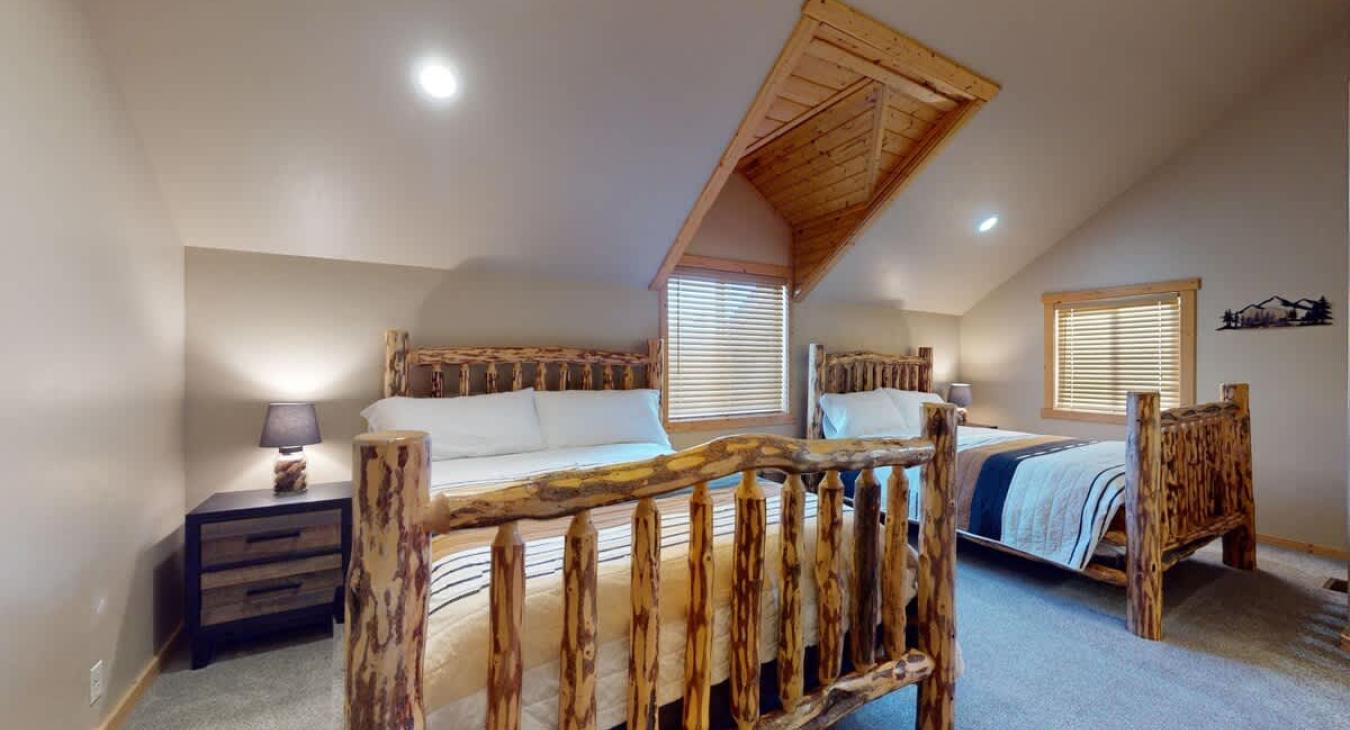 Fourth Bedroom upstairs with 2 queen size beds.