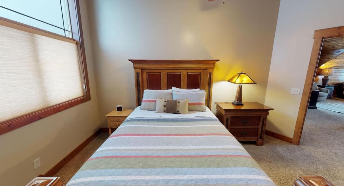 The third bedroom has a queen bed, window, an closet to store your belongings.