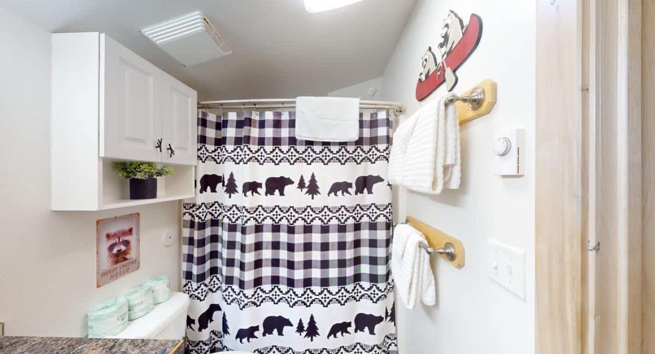 This bathroom has storage located here for your items during your stay.