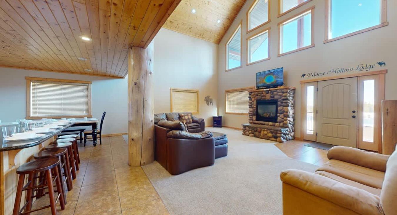 The open kitchen blends seamlessly into the cabin's cozy living area, creating a welcoming space perfect for gathering and unwinding.