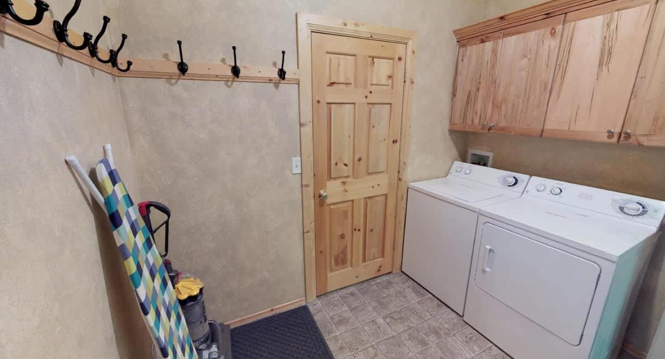 Conveniently located in the garage entrance is a mud room with a washer and dryer for you to use. Laundry soap is provided.
