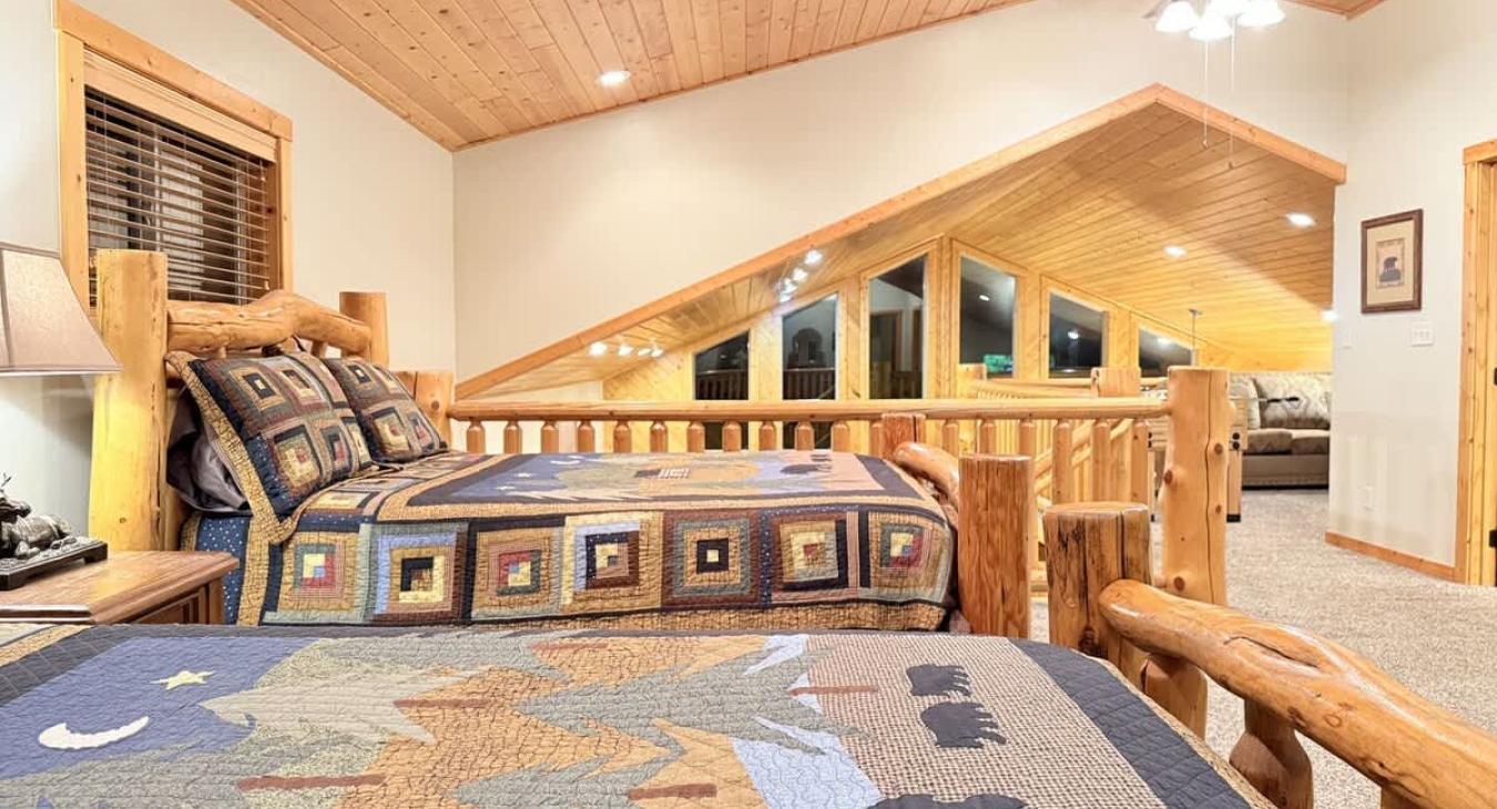 2 Queen size beds are located in the loft to sleep more guests.