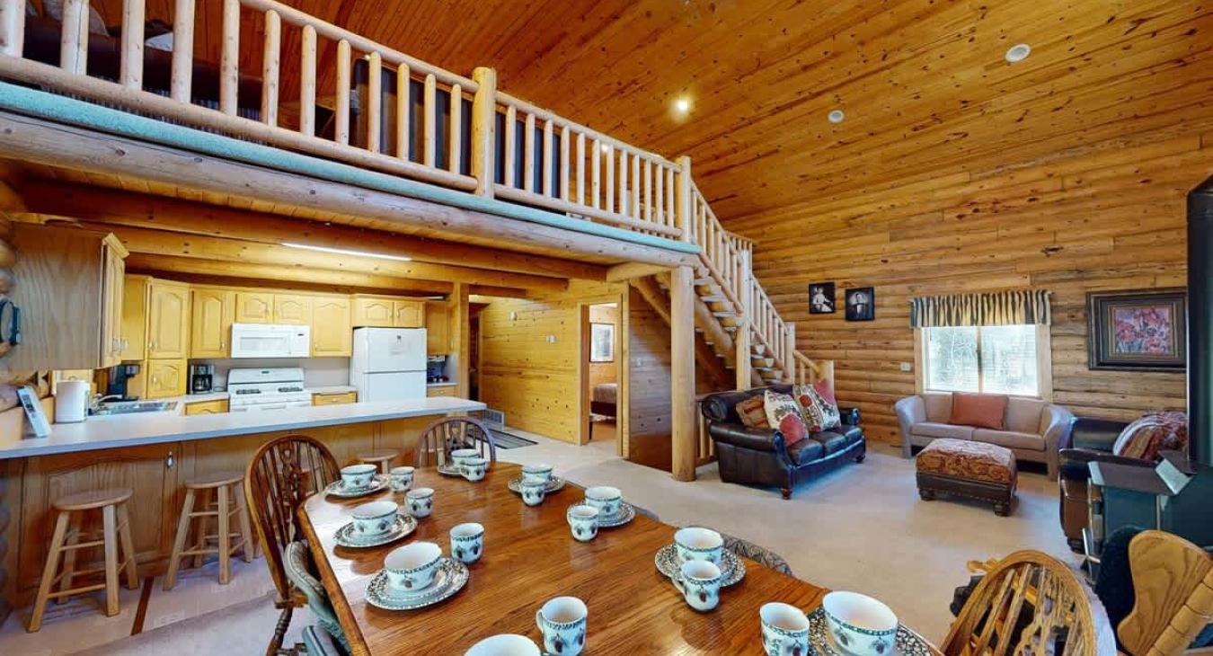 Large open view of dining area, kitchen, and living room.