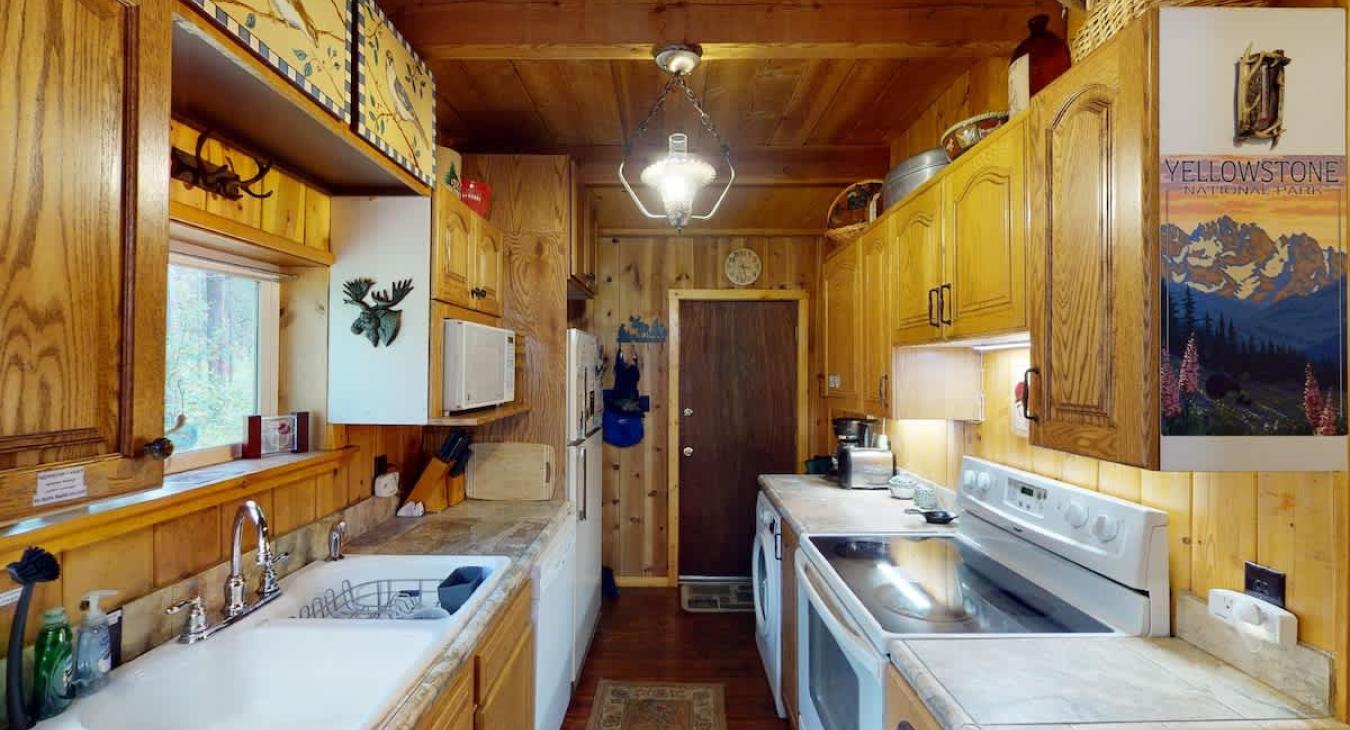 Full kitchen with appliances, dishes, and basic spices.