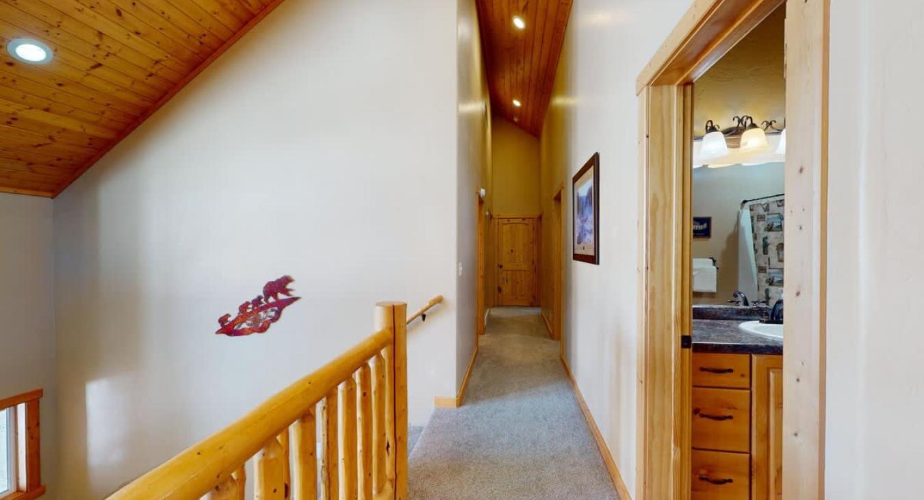 Upstairs hallway with access to the bathroom and bedrooms.