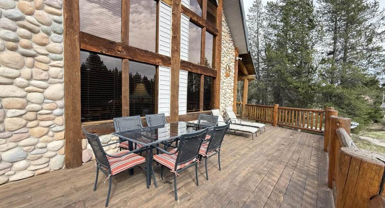 Beautiful outdoor deck with lots of seating to relax and enjoy the scenery.