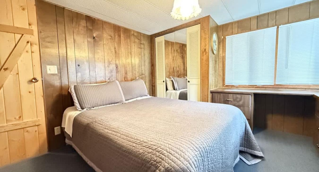 Master bedroom with a queen bed.