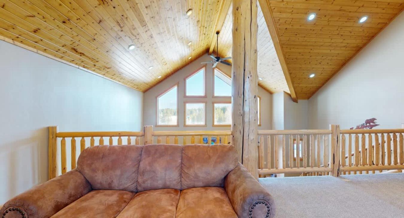 This cabin features large windows that let light in during the day.