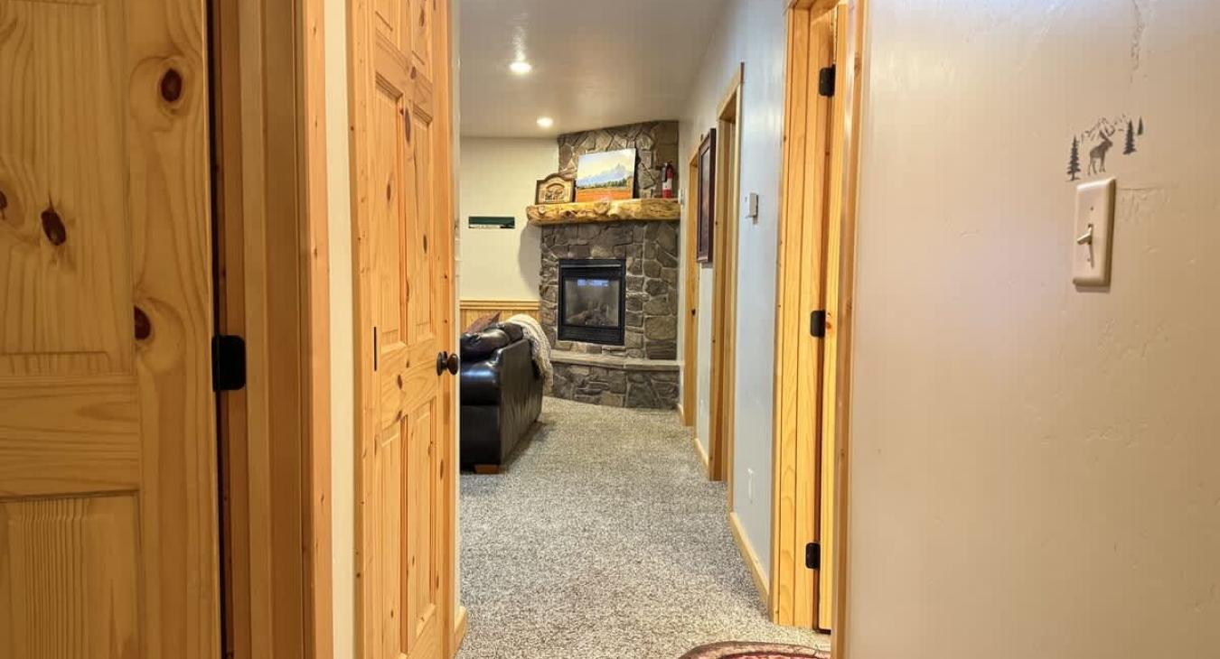 Hallway in the basement to access the living area and bedrooms.