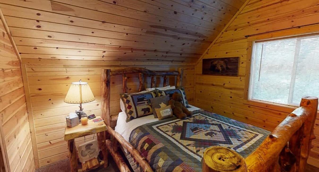 Bedroom #3 located upstairs with a Queen size bed.