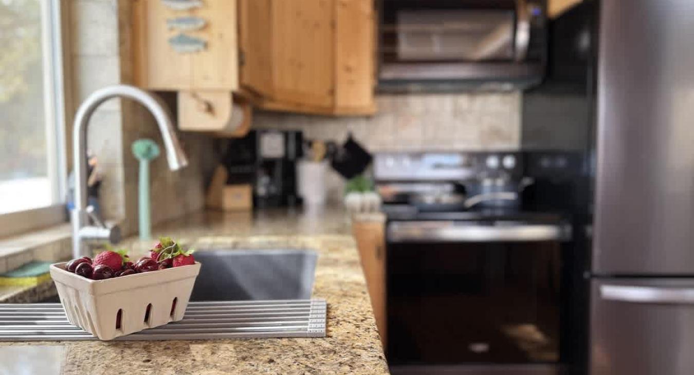 The kitchen in this cabin exudes warmth and practicality, designed for both comfort and functionality.