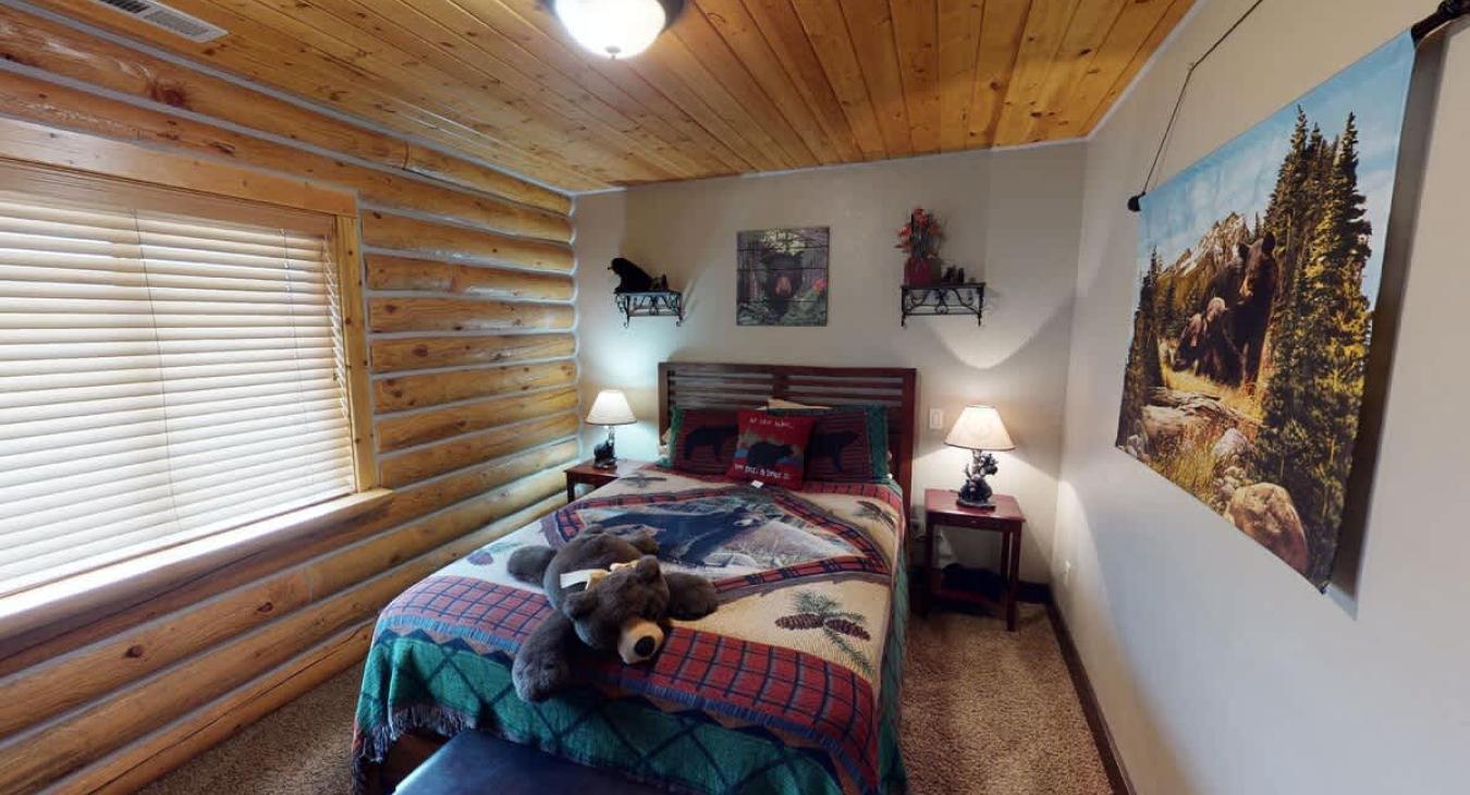 Bedroom 1 located upstairs with a Queen size bed.