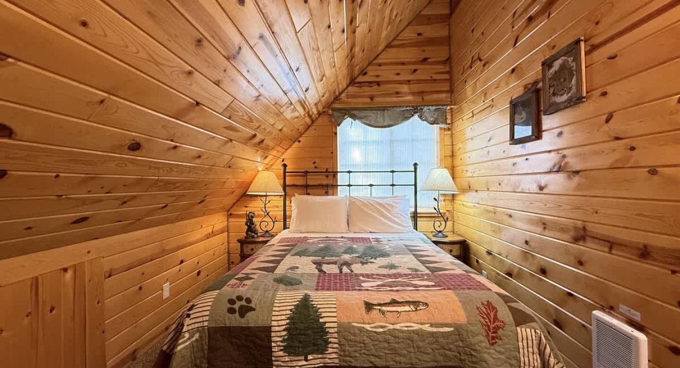 Bedroom #2 located upstairs with a Queen size bed.