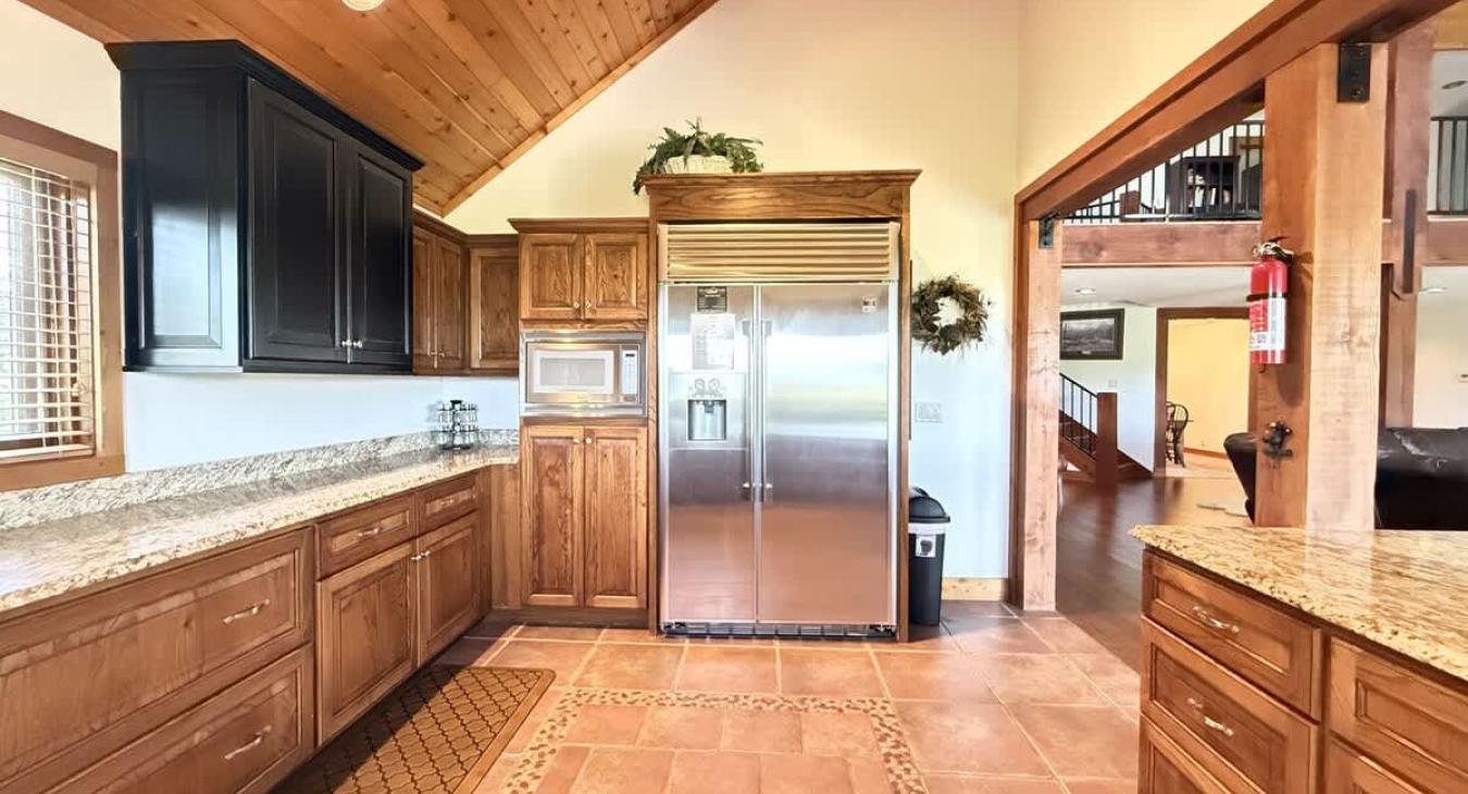 The openness of the kitchen makes it easy to chat with friends or family while cooking, or to catch the glow of the fire and the sound of laughter as you move between the rooms.