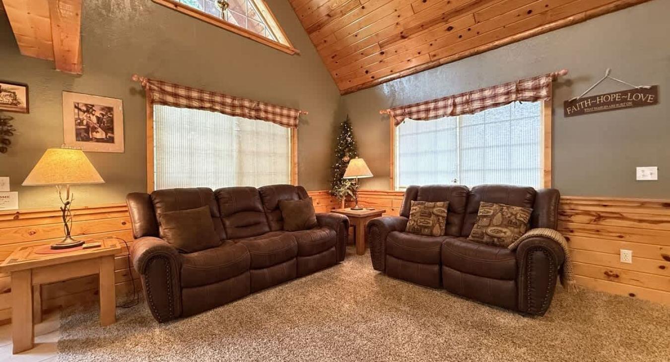 Living room with open windows to let in lots of natural light.