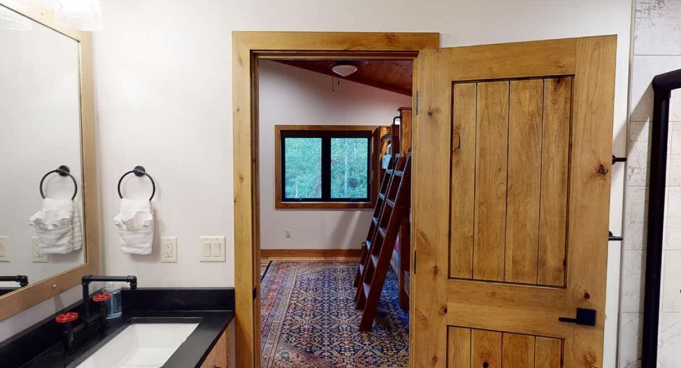 View of the bunk room from the connected Jack and Jill bathroom.